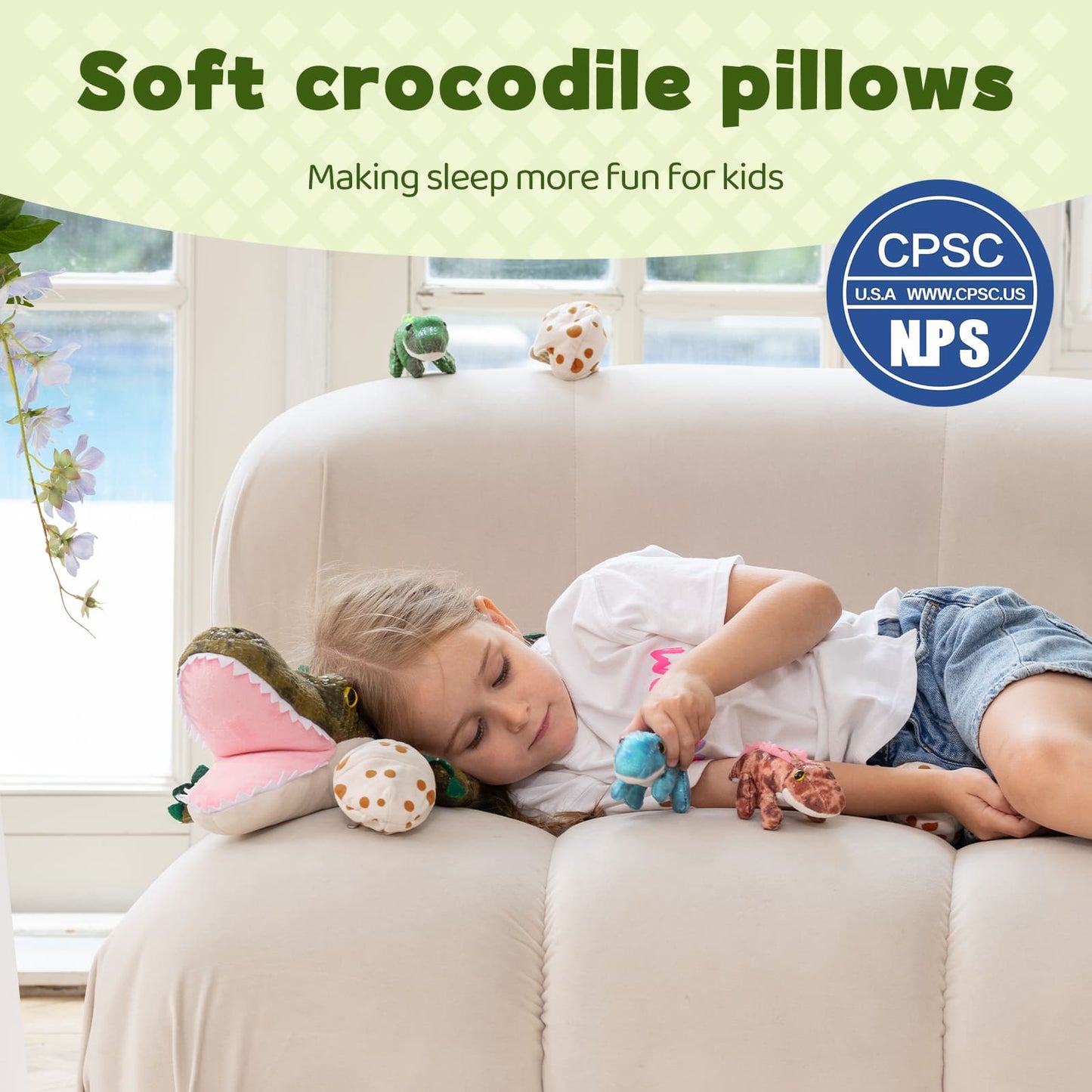 Child sleeping on a couch with soft crocodile pillows, CPSC and NPS logos visible